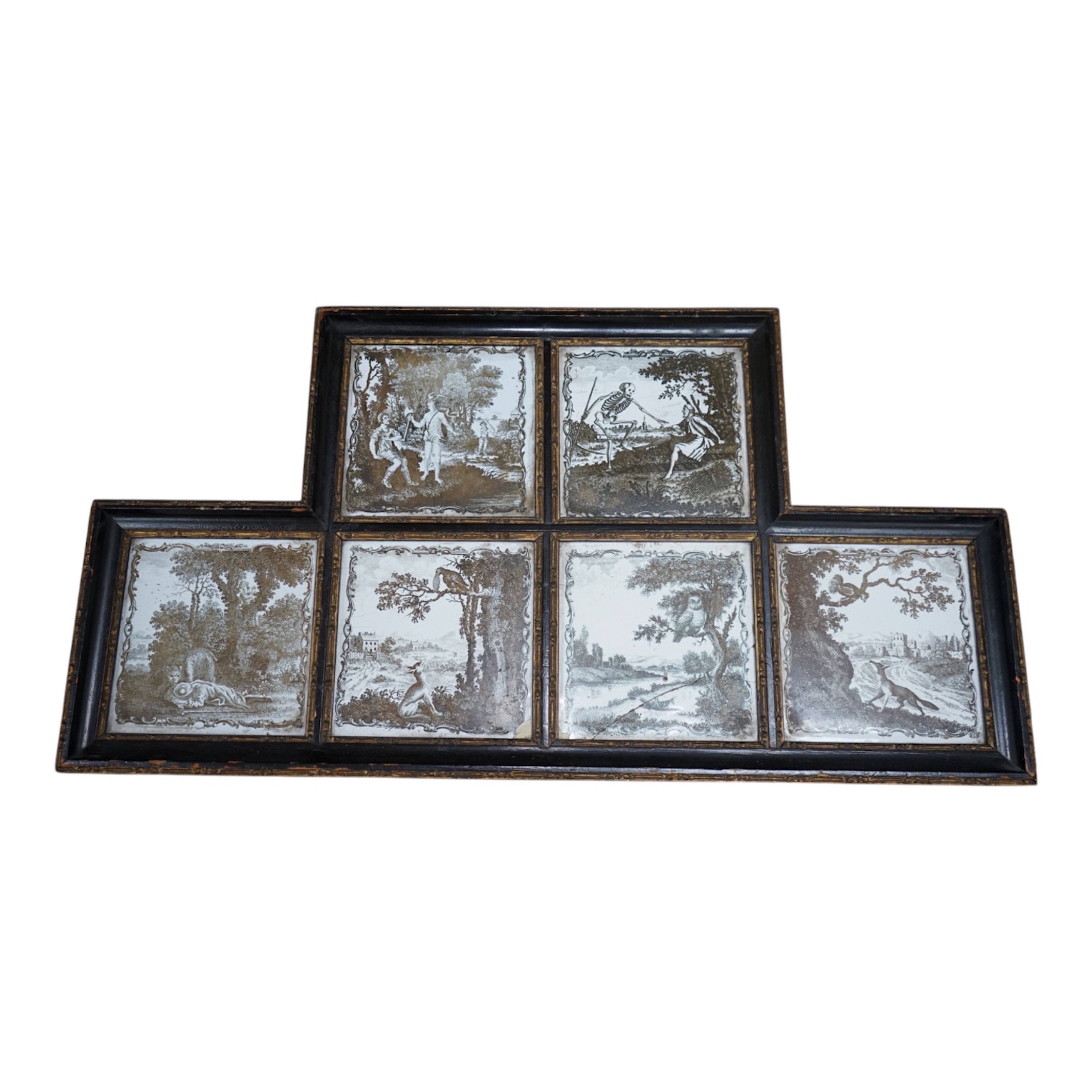 A framed set of six 18th century Liverpool delftware black and white printed tiles, Aesop’s Fables by Sadler, 57cm wide. Condition - fair